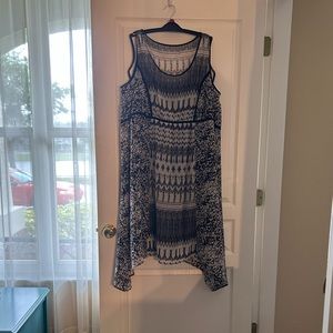 Sheer white and black sleeveless dress with black slip liner